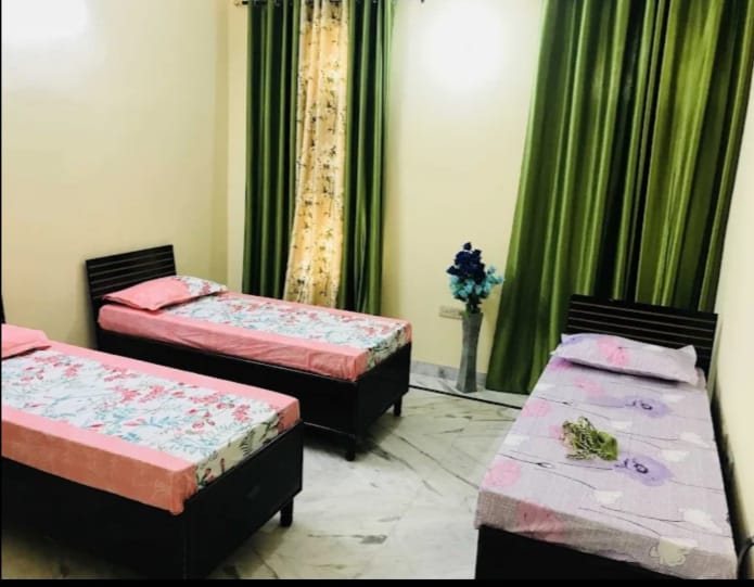 Triple sharing room at BABA PG HOUSE